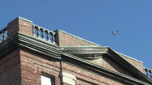 A plane flying overhead in Jackson Heights