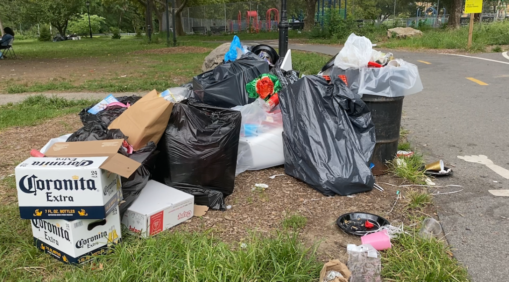 Heap of garbage in Bronx Park, the remains of a birthday party
